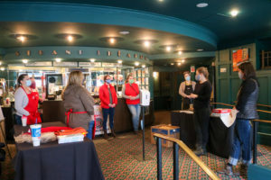 The lobby at The Strand Theatre in Rockland, Maine, as volunteer are briefed on the day's activities, Jan. 18. 2021 - food drive