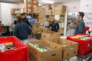 Volunteers sorting food at AIO Food & Energy Assistance in Rockland, Maine